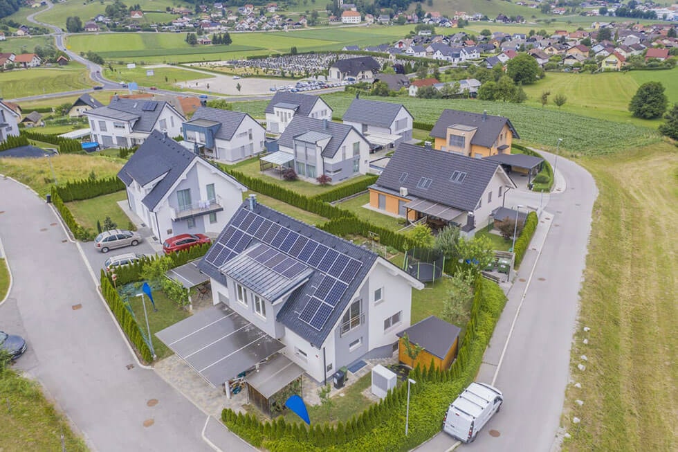 Aerial view of a new residential area with semi-detached houses in a rural setting.