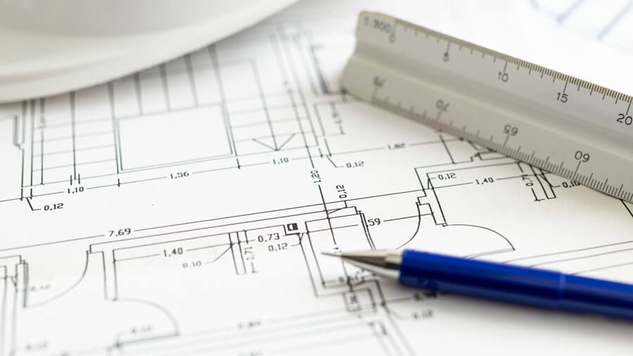 Close-up of a floor plan detail with a pencil and set square.