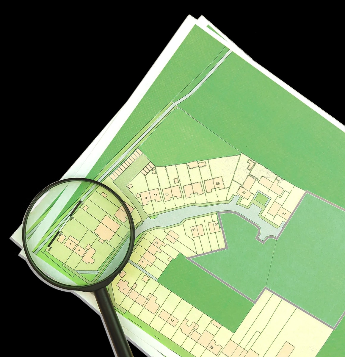 A development plan with lots of green space, with the head of a magnifying glass resting on one corner