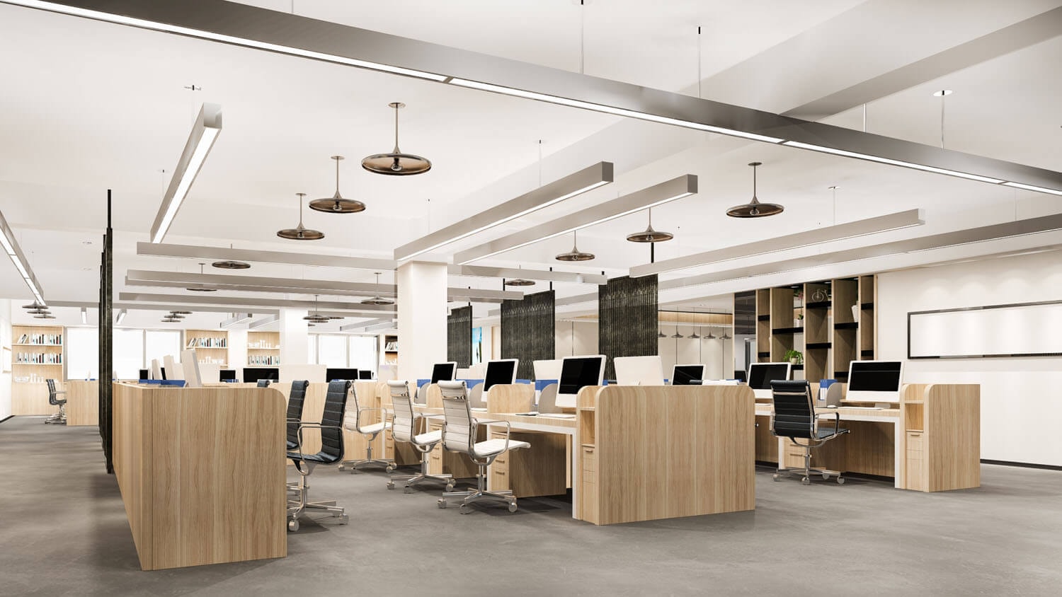 Shot of a brightly lit open-plan office from the corner of the room with 3 rows of wooden desks, adjustable partition curtains between the workstations and shelving units on the walls.