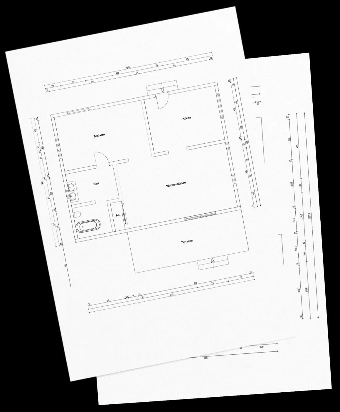 Close-up at an angle of the dimensioned floor plan of a 2-room apartment with a terrace.
