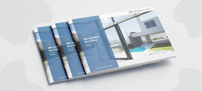 Three bound property exposés in landscape format stacked on top of each other, viewed from an angle.
