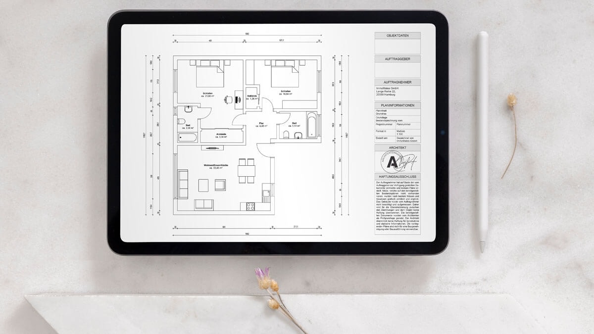 Tablet showing a dimensioned floor plan with an architect's stamp, depicting a 3-room apartment with two bathrooms and a combined living and dining area with an open kitchen