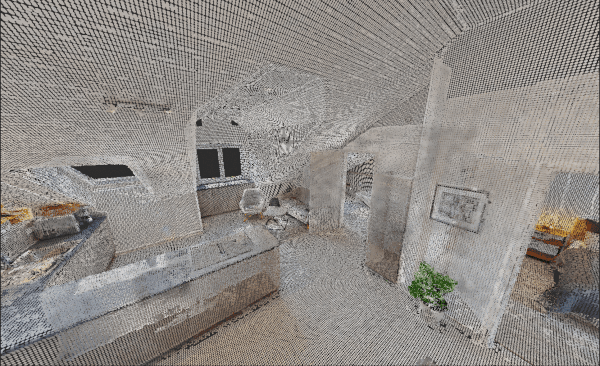 Detailed point cloud of an attic apartment with a dormer, sloped ceilings, and an open kitchen